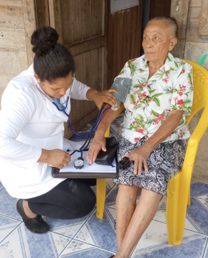 doctor taking blood pressure of patient