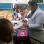 doctor traveling to communities providing care to children
